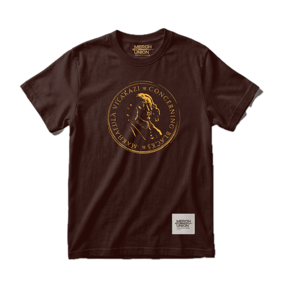 Dark brown T-shirt with a gold circular coin-seal print reading Makhafula Vilakazi, Concerning Blacks